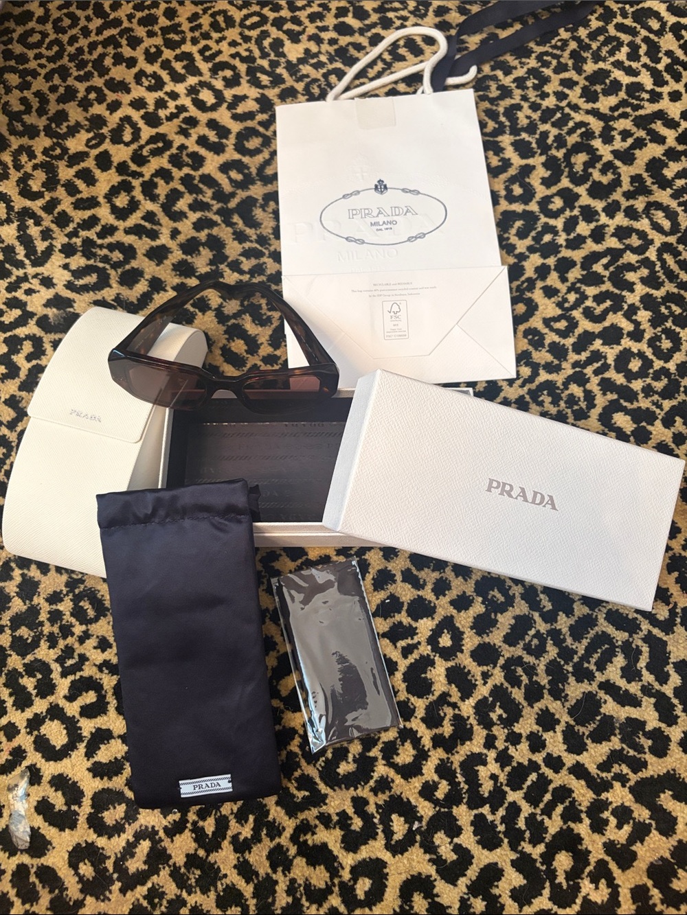 Prada small Sunglasses guaranteed authentic in store now. Comes with everything!